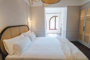 Posteľ alebo postele v izbe v ubytovaní ORA Hotel Priorat, a Member of Design Hotels