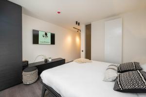 Voodi või voodid majutusasutuse Georges & Madeleine Apartments toas