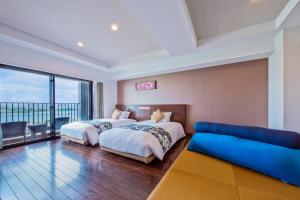 Llit o llits en una habitació de Senagajima Island Resort & Spa
