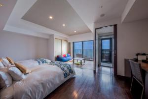 Llit o llits en una habitació de Senagajima Island Resort & Spa