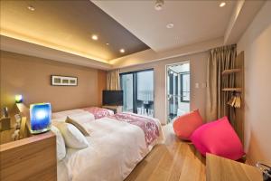 Llit o llits en una habitació de Senagajima Island Resort & Spa