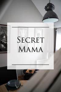 a sign for a secret mama on a table at SECRET MAMA with Aircon 150 meters from parking Rapp in Colmar