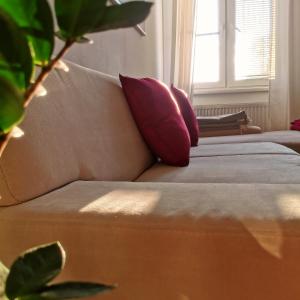 a couch with pillows on it in a room at CozyHome in Old Town, Presidential apartment in Bratislava