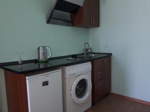 A kitchen or kitchenette at Art Guest House in KASKAD