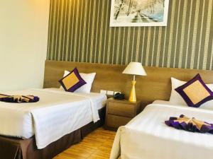 Кровать или кровати в номере Nesta Hotel Phu Quoc
