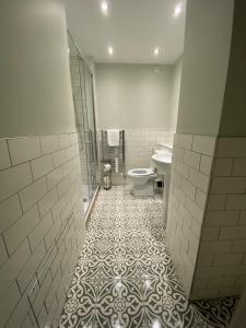 a bathroom with a toilet and a sink at College Hill Shrewsbury in Shrewsbury