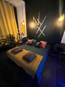 Cama o camas de una habitación en Nyx suite d’exception