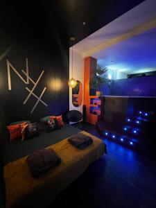 Cama o camas de una habitación en Nyx suite d’exception