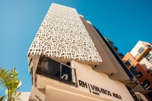 a building with a white roof with a window at Hotel RH Vinarós Aura in Vinarós