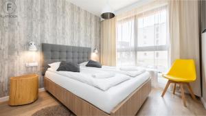 Posteľ alebo postele v izbe v ubytovaní Flatbook - City Center SPA Apartments Toruńska