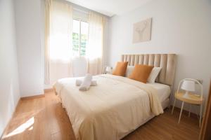 a bedroom with a bed with a stuffed animal on it at YourPlace - Prestigia - Hay Riad in Rabat