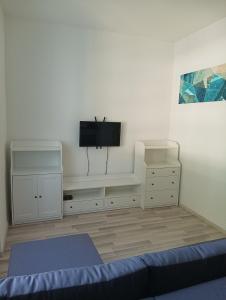 Televízia a/alebo spoločenská miestnosť v ubytovaní Happy Bunnies Apartman II - Siófok