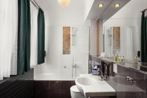 a bathroom with a sink and a toilet and a shower at The Charles in Prague +45 photos