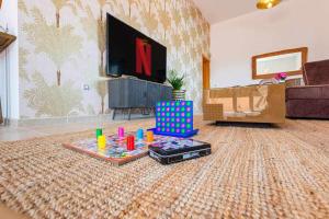 TV a/nebo společenská místnost v ubytování Villa Mini Golf