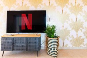 TV a/nebo společenská místnost v ubytování Villa Mini Golf