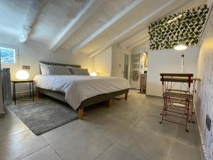 a bedroom with a large bed and two tables at APARTAMENTO LUCÍA Y ALISA in Inogés