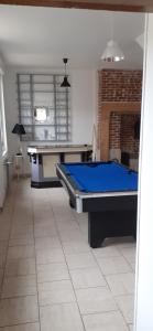 a room with a pool table in a room with at Ferfay Holiday-Home in Ferfay
