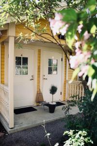 a front door of a house with a potted plant at Villa Sol Bed & Breakfast in Borgholm