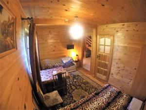 an overhead view of a bedroom in a log cabin at Domek NAD STRUMIENIEM in Baligród