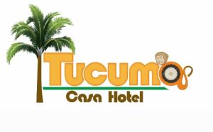 a palm tree and the tulum can hotel logo at Tucuma Casa Hotel in Leticia