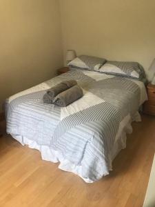 a bed with two towels on top of it at Ballygastle in Lisdoonvarna