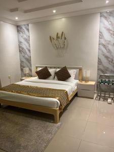 En eller flere senge i et værelse på Jeddah Shadows Hotel