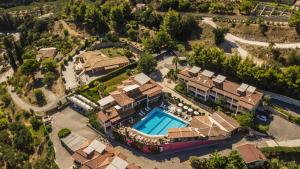 an aerial view of a house with a swimming pool at Sea View Village in Vasilikos