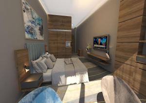 una camera con un letto e una televisione di Van Royal Hotel a Erbil
