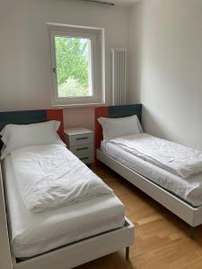 Oleeva Apartment tesisinde bir odada yatak veya yataklar