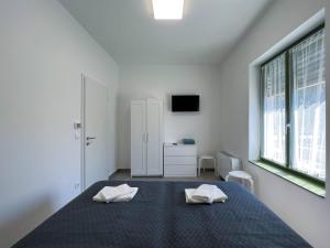Letto o letti in una camera di Lujza Apartman