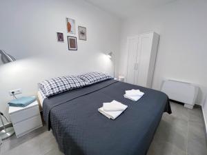 Letto o letti in una camera di Lujza Apartman
