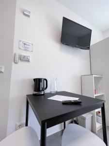 TV a/nebo společenská místnost v ubytování Lujza Apartman