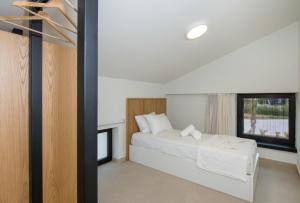 A bed or beds in a room at Fairytale Villas