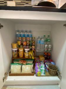 a refrigerator filled with lots of food and water at CG's place (modern condo in cdo) in Cagayan de Oro