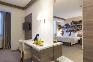 Postel nebo postele na pokoji v ubytování Hotel Royal Inn