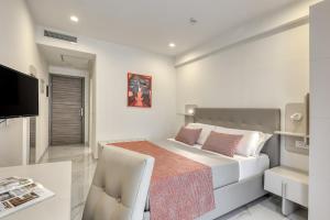 Posteľ alebo postele v izbe v ubytovaní Vomero High Hotel