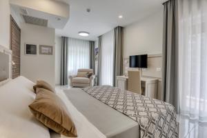 Posteľ alebo postele v izbe v ubytovaní Vomero High Hotel