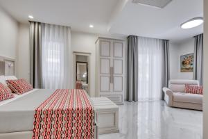 Posteľ alebo postele v izbe v ubytovaní Vomero High Hotel