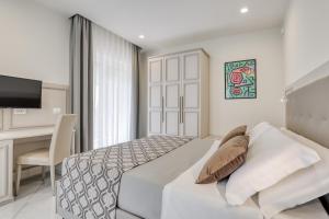 Posteľ alebo postele v izbe v ubytovaní Vomero High Hotel