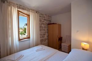 Posteľ alebo postele v izbe v ubytovaní Rotondo Apartments