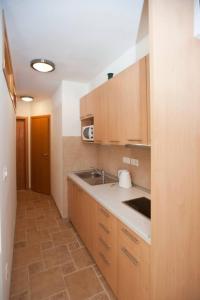 Kuchyňa alebo kuchynka v ubytovaní Rotondo Apartments
