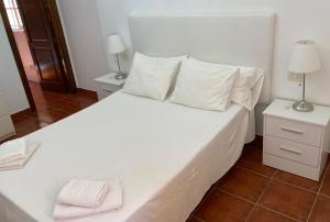 Ein Bett oder Betten in einem Zimmer der Unterkunft VV La Escondida