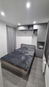 Postel nebo postele na pokoji v ubytování HT Apartman