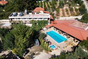 an aerial view of a building with a swimming pool at Hotel Dort Mevsim in Pamukkale