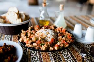 a table with a plate of food on a table at Hotel Dort Mevsim in Pamukkale