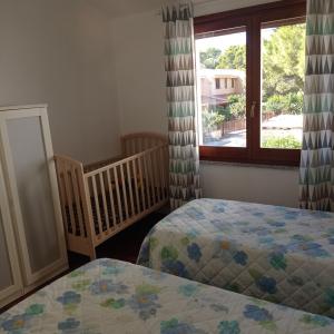A bed or beds in a room at Margherita Holiday House
