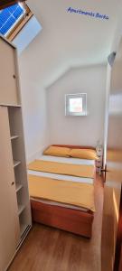 Posteľ alebo postele v izbe v ubytovaní Apartments Borka