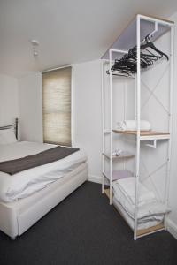 a bedroom with a bed and a white bunk bed at Flat 1 Bellevue in Bristol
