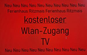 a red sign with the words new new new new new new new new new new at Ferienhaus Ritzmais in Bischofsmais