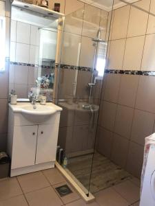 a bathroom with a shower and a sink at Apartment Bonaca in Komarna +58 photos